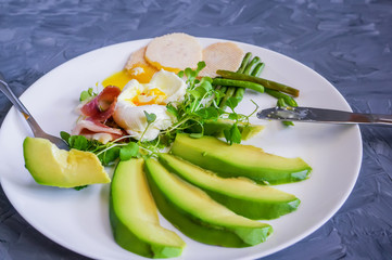 Perfectly toasted avocado toast with a delicious poached egg filling