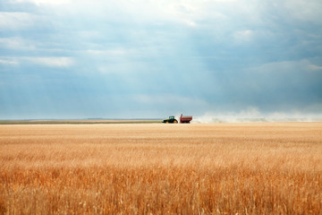 Distant view of tractor on field against sky © Cavan for Adobe