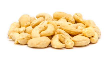 Handful of raw cashew seeds (Anacardium occidentale) without shell, close up, isolated on white background