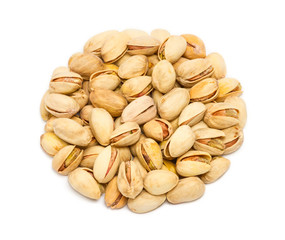 Handful of pistachio nuts (Pistacia vera) in the shell, close up, isolated on white background