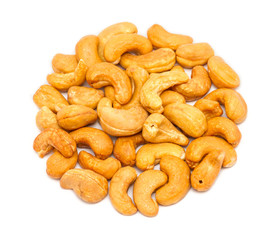 Handful of roasted cashew seeds (Anacardium occidentale) without shell, close up, isolated on white background