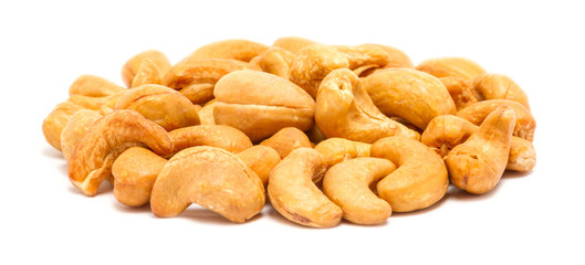 Handful of roasted cashew seeds (Anacardium occidentale) without shell, close up, isolated on white background