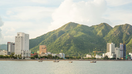 Panorama of one part of the city of Nha Trang with mountains.