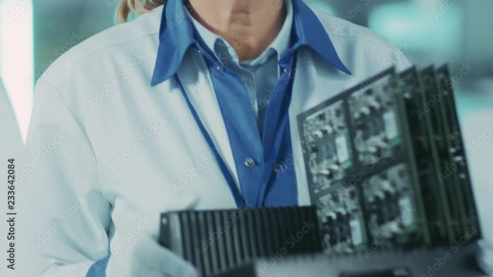 Poster on high-tech factory female worker carries batch with electronic printed circuit board assembled wit