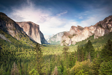 Scenic view of trees amidst mountains against sky © Cavan for Adobe