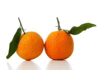 tangerines with leaves isolated on white