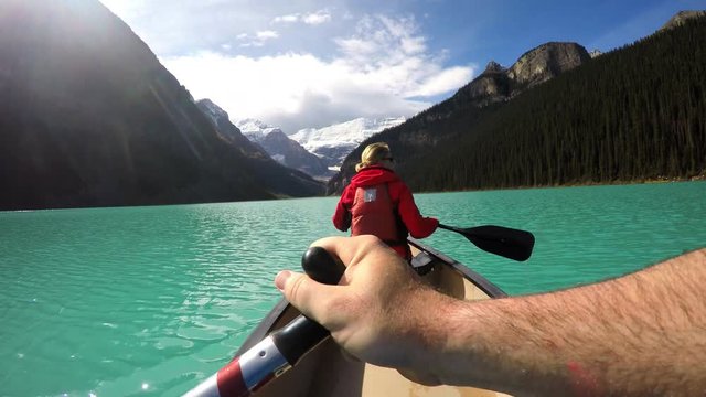 View of young couple Kayaking Lake Louise Alberta Canada