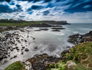 Obraz premium Beautiful sea landscape on Causeway Road, Co Antrim, Northern Ireland.Photo taken on a small road to Dunseverick Harbour. From here you can see Dunseverick Falls.