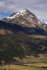 Fototapeta premium Snow on Hintereggkogel and Ochsenbug Mountain peaks in ski resort Matrei in Osttirol, Austria, sunny day