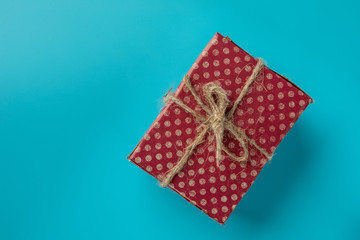 red gift box on blue background. copyspace