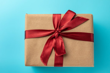 Flat lay of gift on blue background