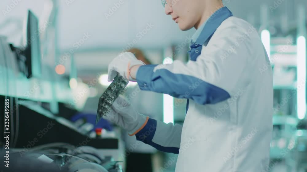 Poster high-tech factory: quality control inspector checks electronic printed circuit board it for damages.