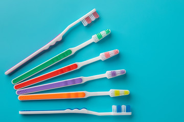 toothbrushes in the form on a blue background