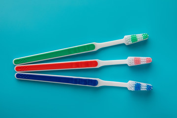 toothbrushes in the form on a blue background