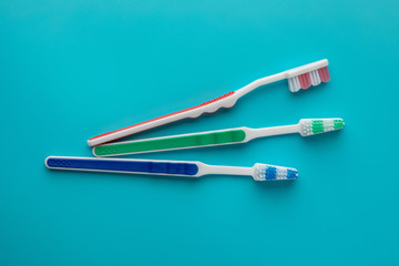 toothbrushes in the form on a blue background
