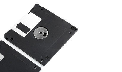 Obraz premium Old computer diskette over white background. Black Diskette.