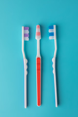 toothbrushes in the form on a blue background