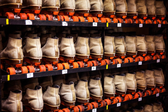 Roller skates on shelves at roller rink