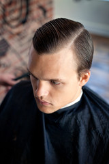 Fototapeta premium Close-up of man in barber shop
