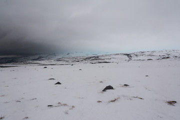 view of the snowy plain, approaching storm, Iceland