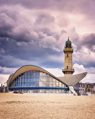 Tea pot and lighthouse on the beach in Warnemünde. © DR pics