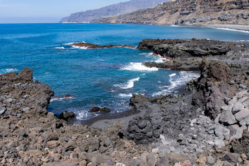 Edge of volcanic lava field meeting the Atlantic Ocean at Playa Los Guirres (Playa Nueva), La...