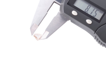 faceted triangular shaped diamonds in a callipers