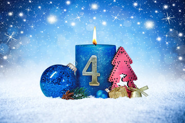fourth sunday of advent blue candle with golden metal number red decoration one on wooden planks in...