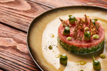 Classic tartare meat with ingredients on plate