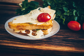 Sandwich with maasdam cheese, tomato, cucumber and basil. Tasty breakfast or lunch.