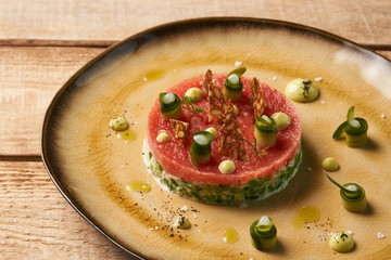 Classic tartare meat with ingredients on plate