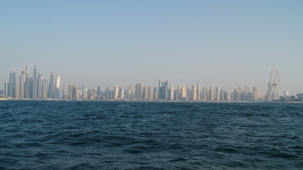View of Dubai skyline in a foggy day from the sea