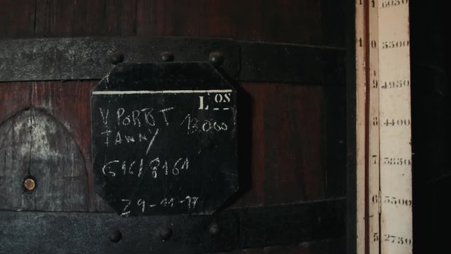 Old wine barrels in a wine cellar, sommelier man tourist dicover, porto, portugal, old factory stock