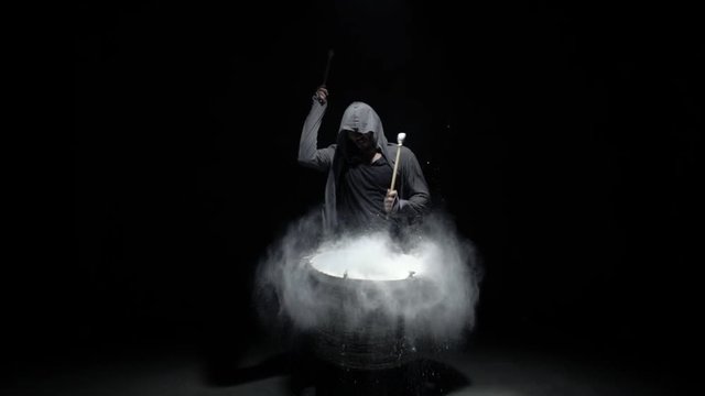 emotional drummer on a black background