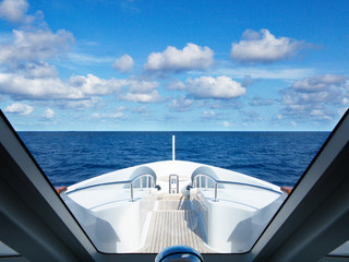Scenic view of clouds over sea seen through yacht