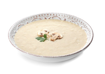 Bowl of fresh homemade mushroom soup on white background