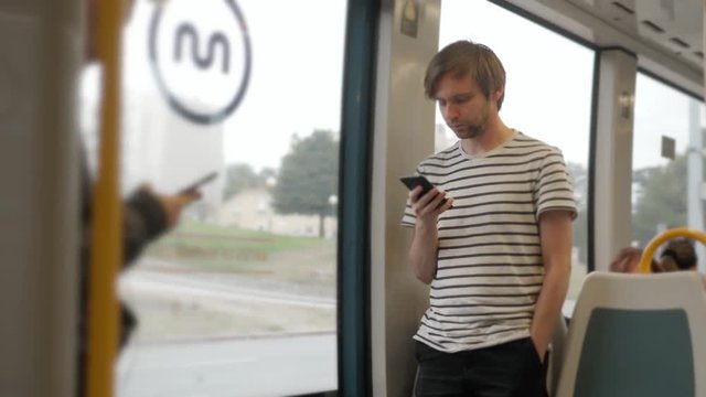 Man voice recognition with smart phone in subway underground railway station train public transportation train bus speech ai