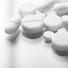 Pharmacy theme, white medicine tablets antibiotic pills.