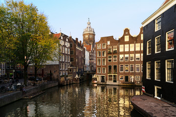Naklejka premium Buildings by canal in city