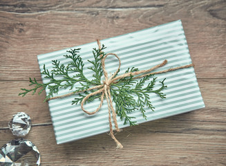 Christmas tree background. Christmas tree with gift decoration on wooden board. Holiday concept.
