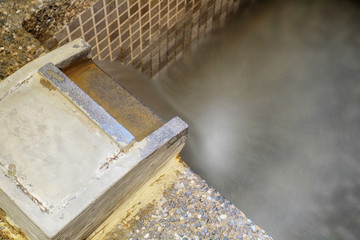 Close up section of onsen bathtub and faucet