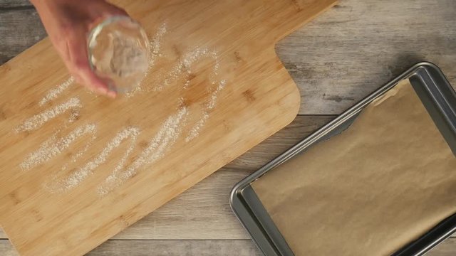 Placing scone dough on cutting board, close up