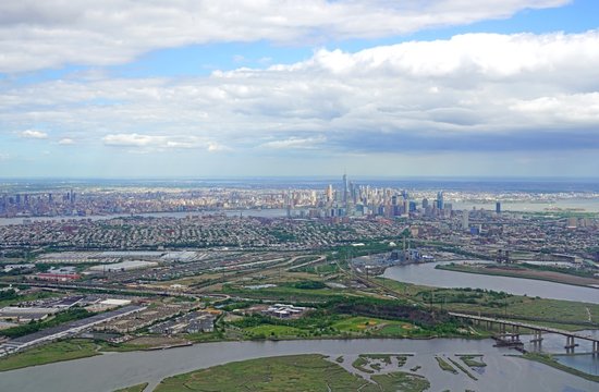 Fototapeta Aerial view of the Manhattan skyline in New York City seen from an airplane window in New Jersey