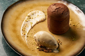 Fondant cake Dessert and pistachio ice cream with English cream