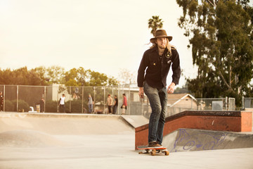 Man skateboarding on sports ramp in park © Cavan for Adobe