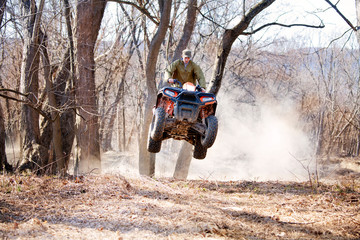 Man ridding quadbike on field © Cavan for Adobe
