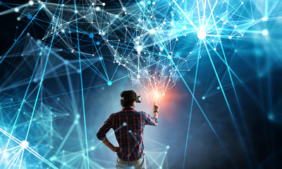 Fototapeta premium Experiencing virtual technology world. Mixed media
