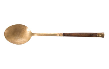 Old brass spoon with wood handle isolated on white background
