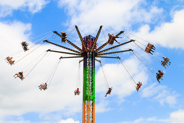 Amusement Park Swing Ride on a bright sunny day.