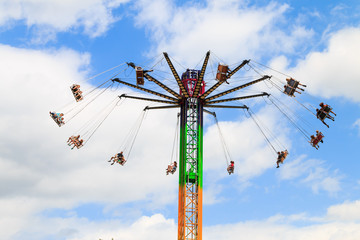 Amusement Park Swing Ride on a bright sunny day.